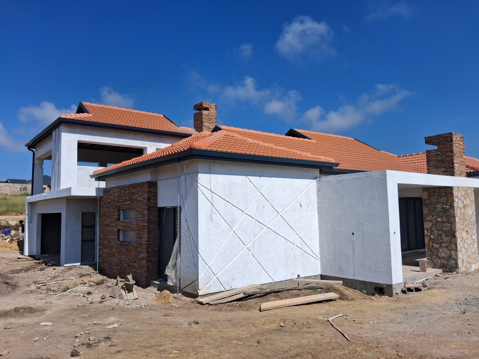 Actual construction photograph used to create the finished-home illustration